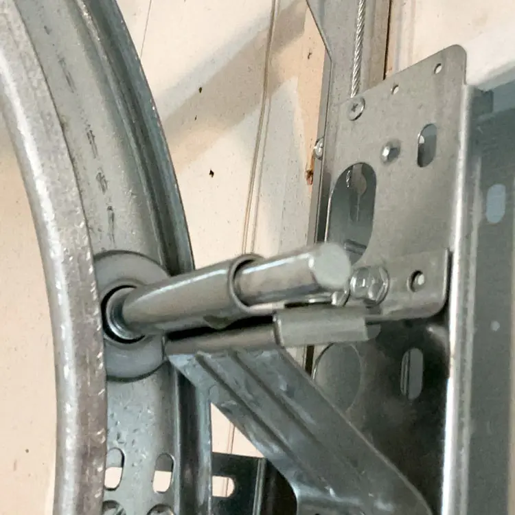 Garage door roller replaced inside the track at a San Antonio, TX home