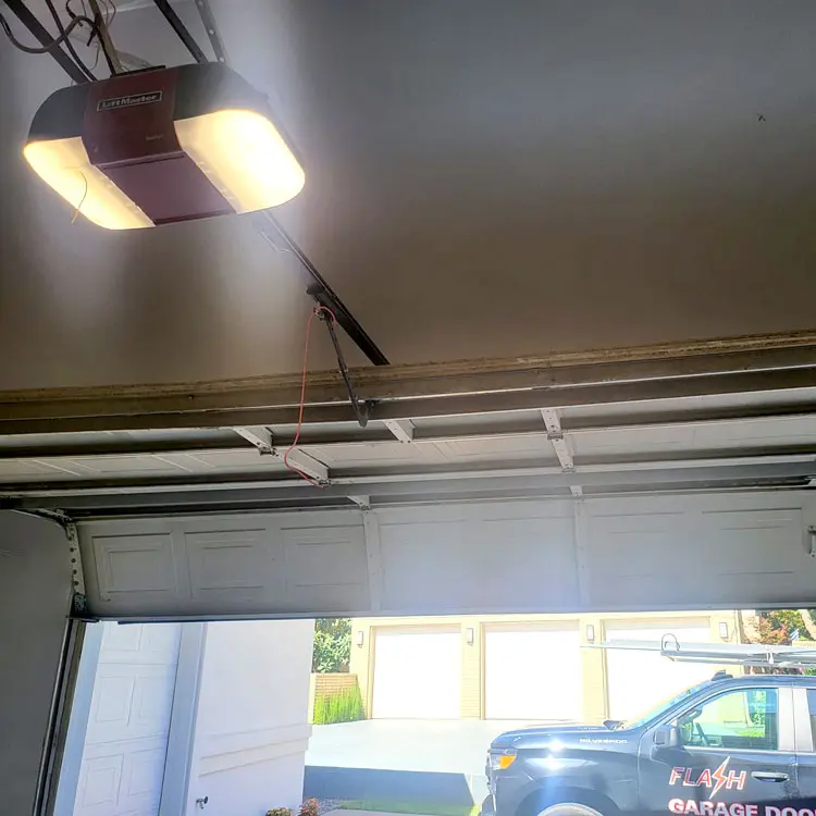 Interior view of an aging paneled garage door before a modern replacement in Oklahoma City, OK