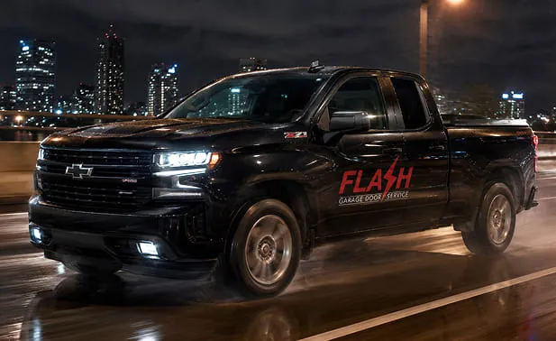 Black Flash Garage Door Service Company Car driving late at night
