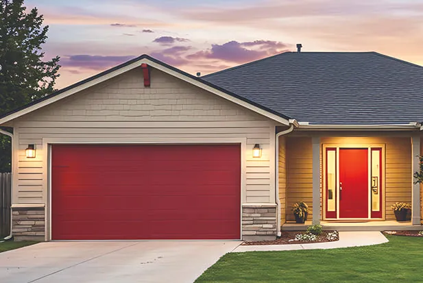 brand new red garage door installed on a one story home near DFW Texas