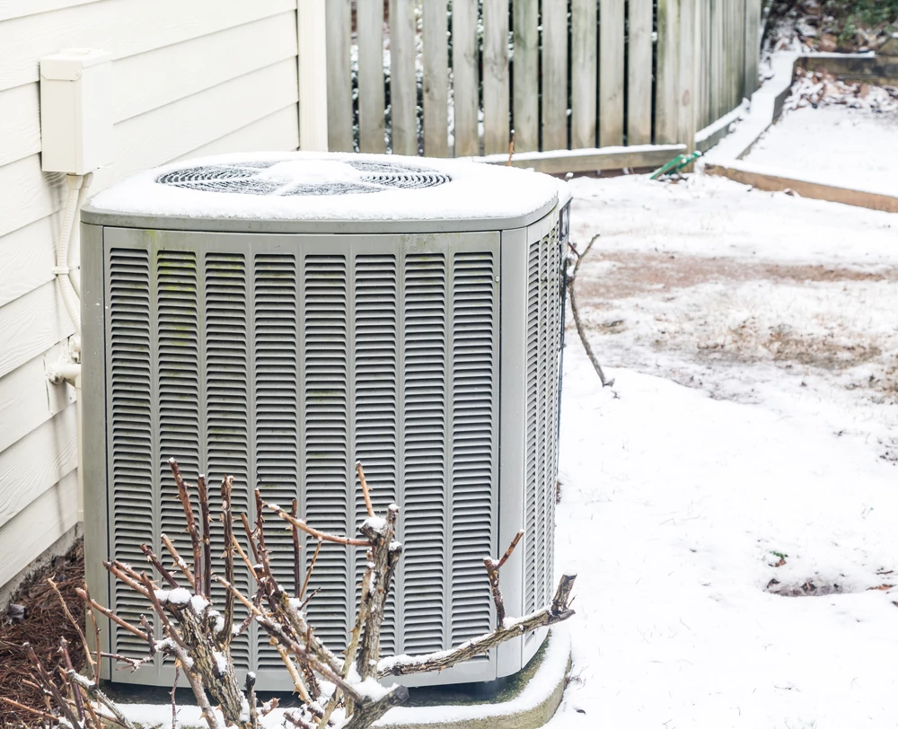 Frozen heat pump unit outdoors
