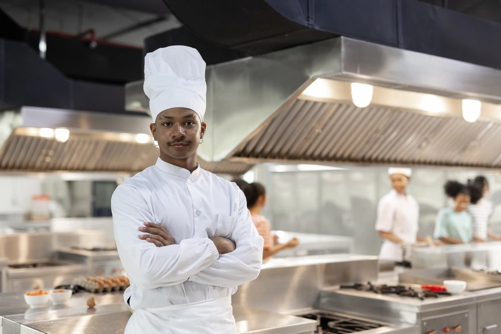 arms crossed chef looking at the camera