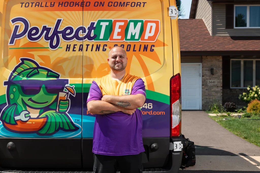 perfect temp technician standing behind their van