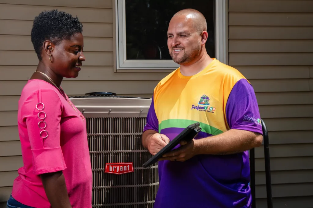 perfect temp worker showing a tablet screen to a homeowner