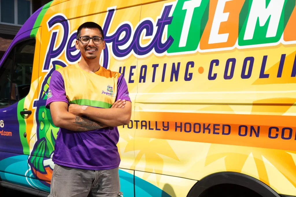perfect temp worker with arms crossed next to their van