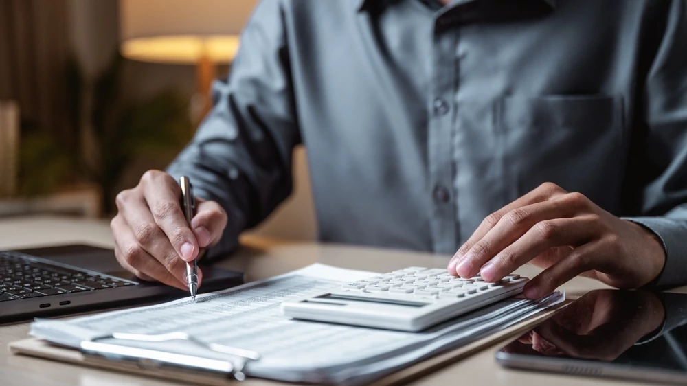 person calculating financing and cost estimates