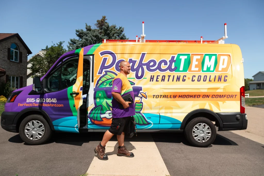 smiling worker getting out of van