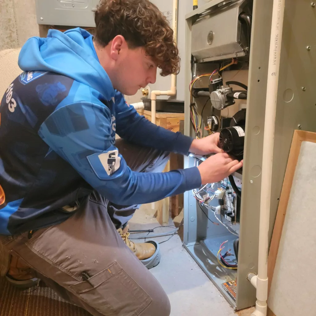 Hunter working on a customers furnace