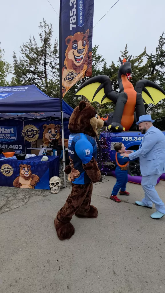 Lawrence De Hart and De Hart mascot having fun at community event