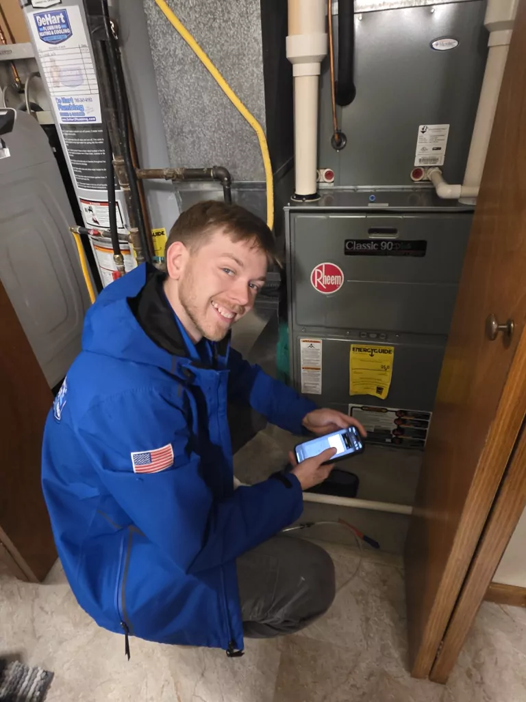 De Hart technician working on furnace repair