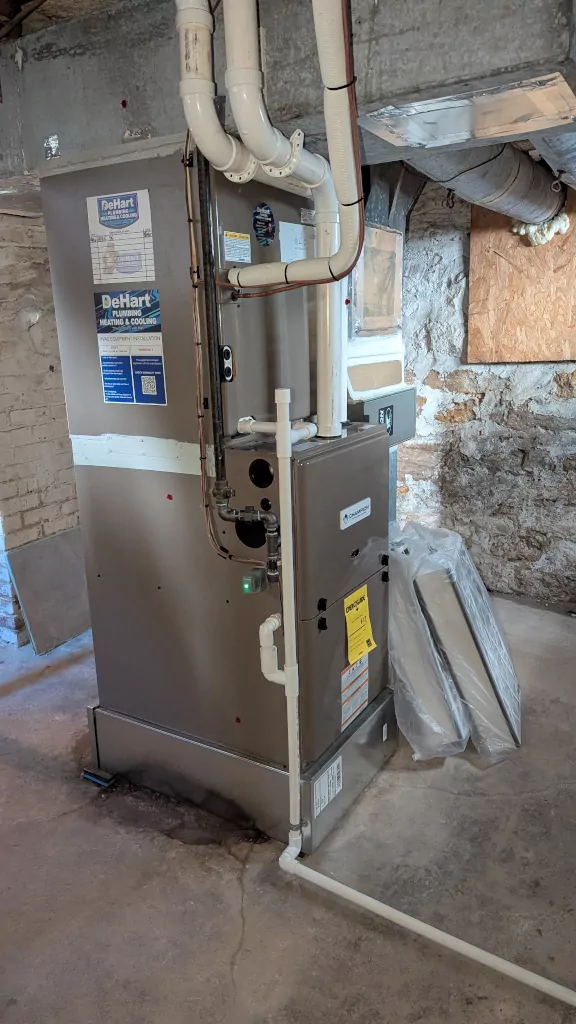 Modern furnace in basement setting