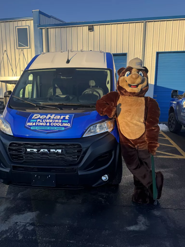 mascot next to van