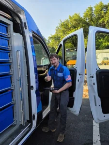 technician with tablet and open van
