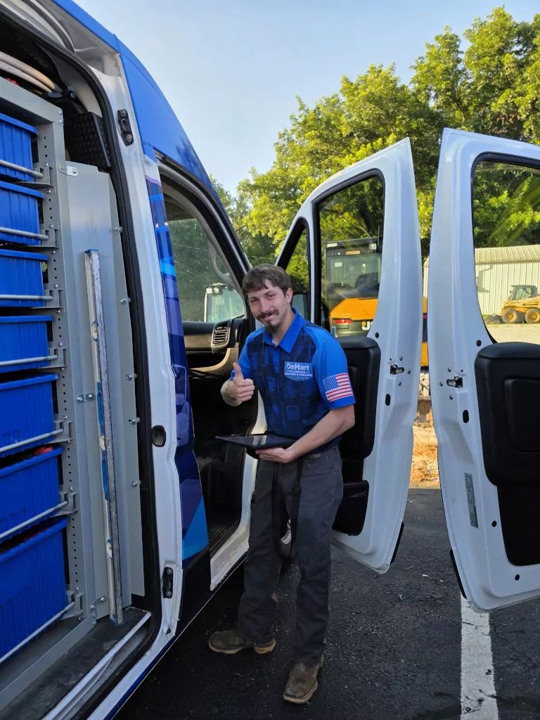 technician with tablet and open van