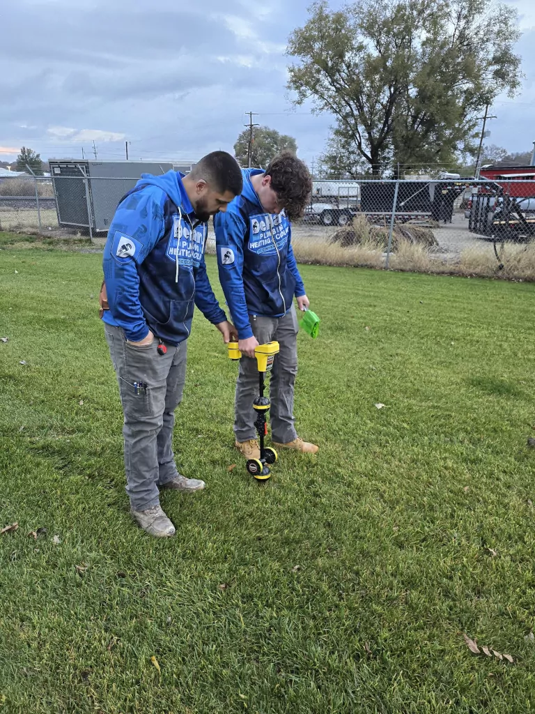 technicians working in a yard
