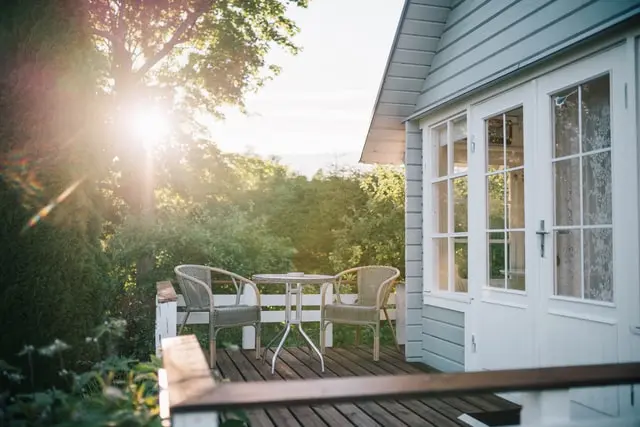 Two chairs and a table on the patio