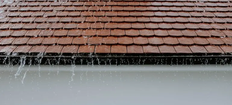 Rain sliding off of a roof.
