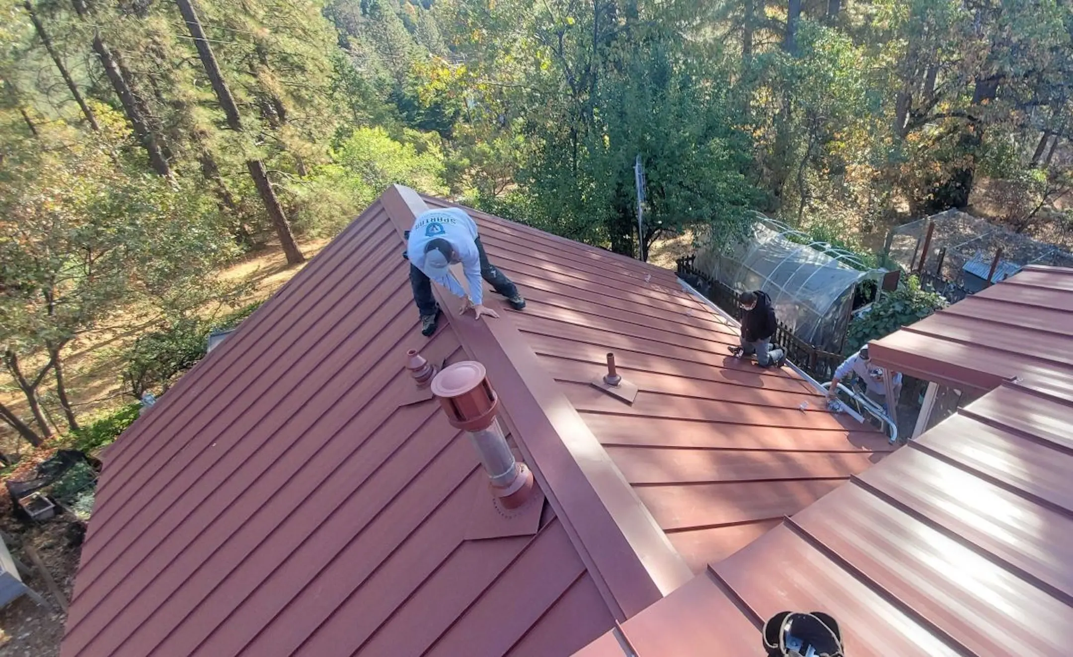 Metal roofing workers