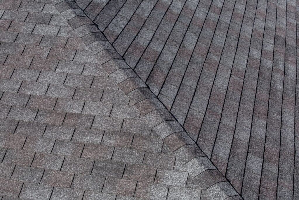 gaf-vs-certainteed-light-grey-and-red-shingles-close-up
