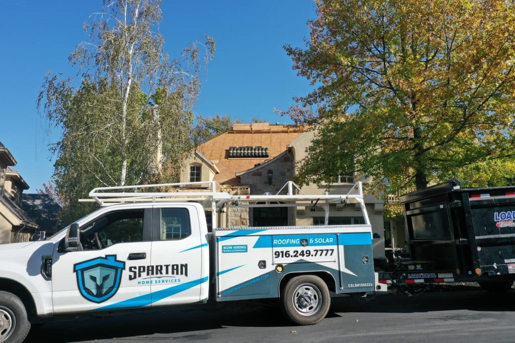 branded truck parked outside house 