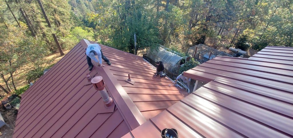 roof leak repair cost red metallic roof