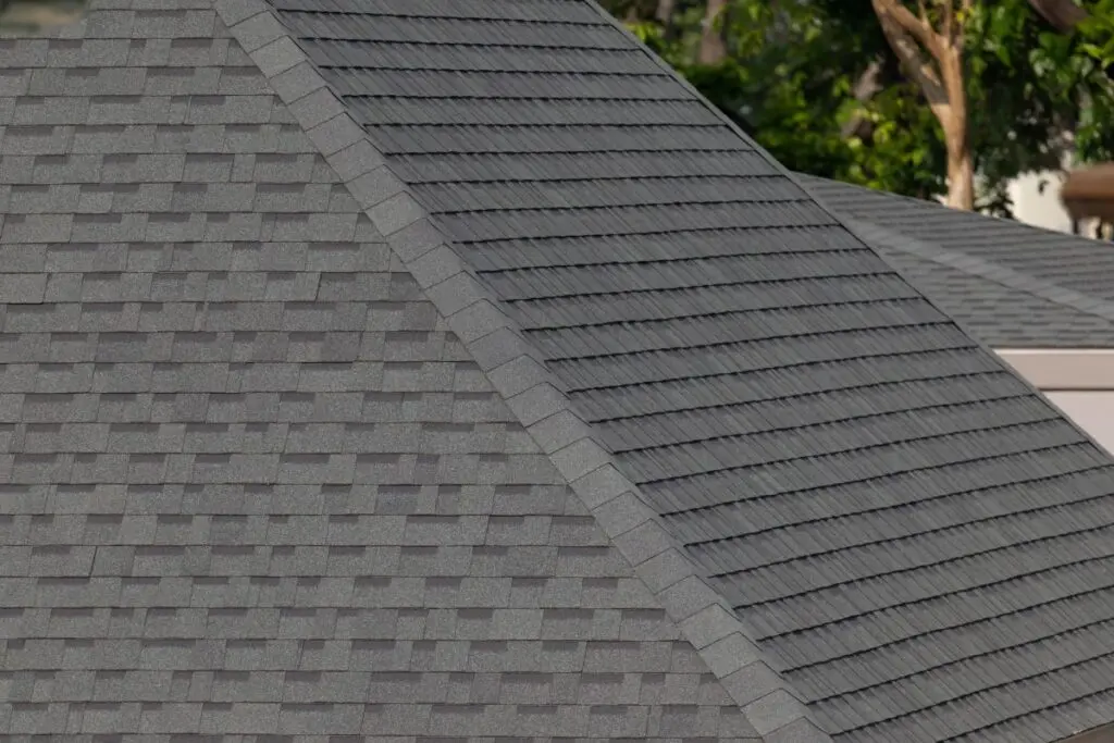 Dark-gray-shingles-line-a-sloped-roof-with-neat-rows