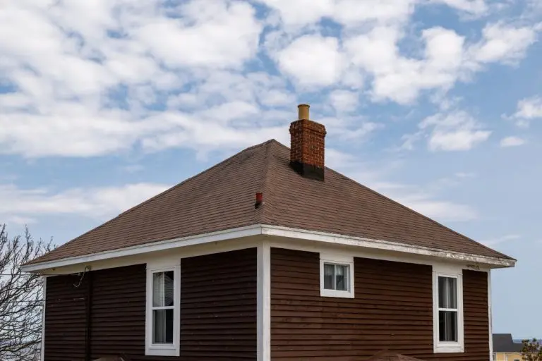 brown shingles roof brick wall chimney