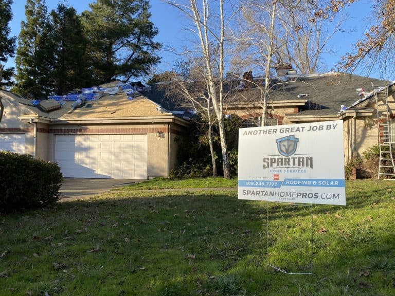 asphalt shingle roofing contractors shingles house Spartan sign outside