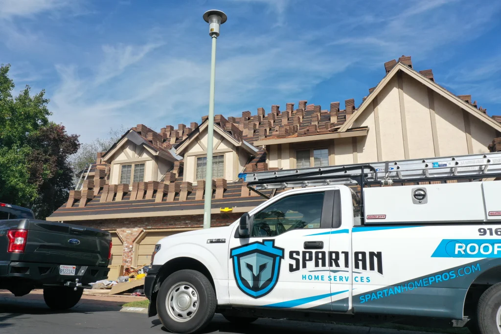 benefits of a new roof branded trucked parked outside project