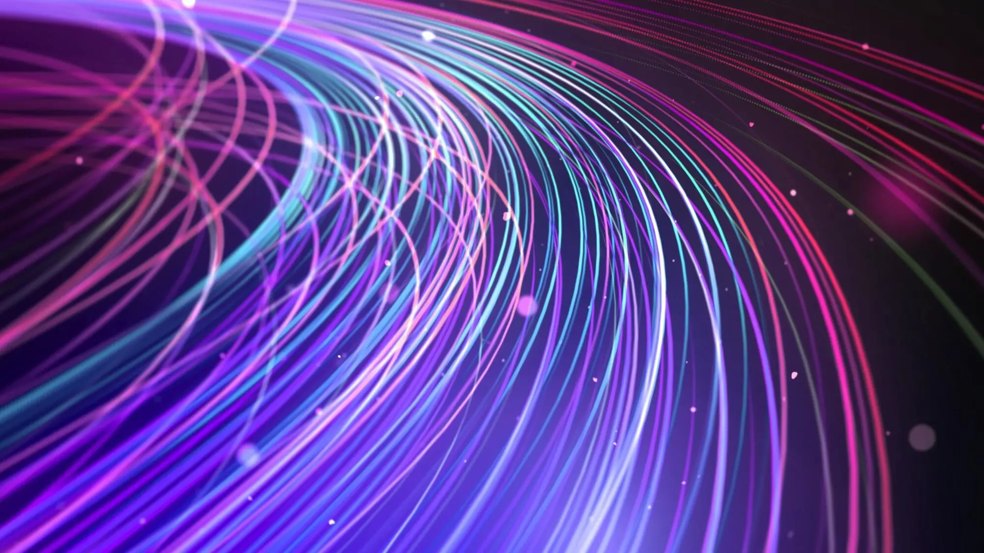 Curved light trails in purple, blue, and pink colors flow across a dark background with scattered bright dots.