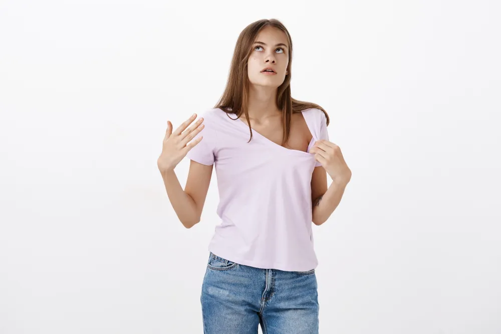 What to Do When Your AC Breaks Down - A Step-by-Step Guide - Woman sweating