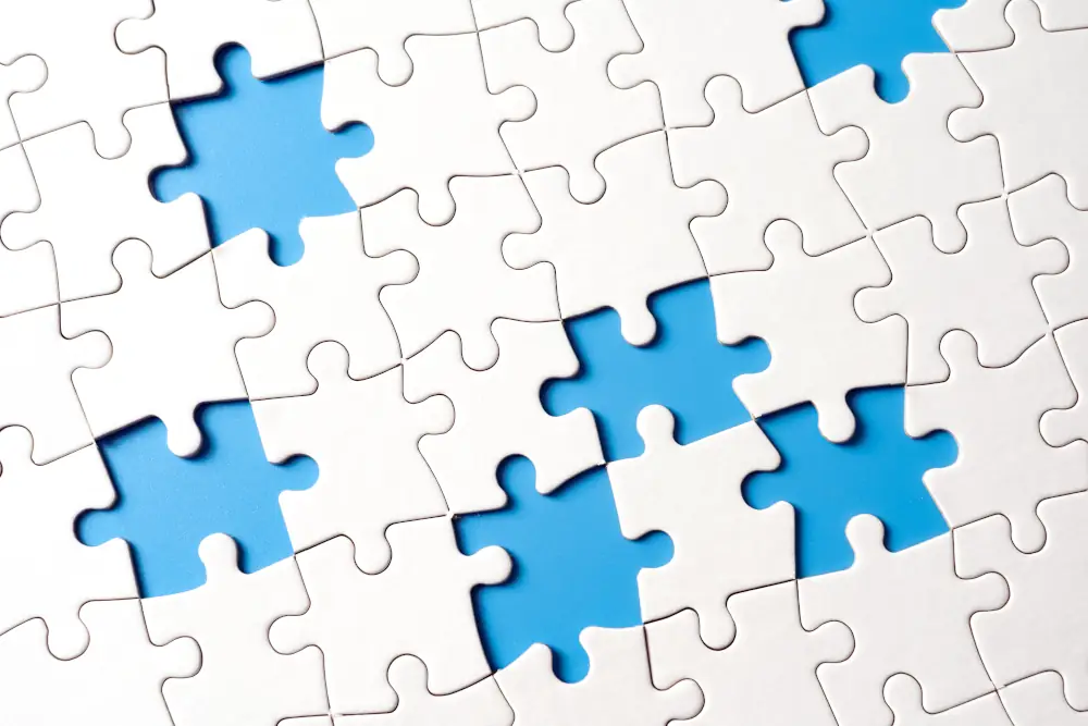 A Breath of Fresh Air: Exploring Different Types of Air Conditioning Systems - White puzzle with some pieces missing. Blue background under puzzle