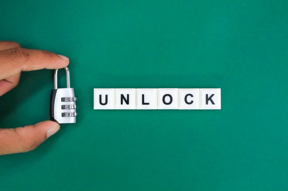 Humidity Ruining HVAC Systems - Hand holding a combination lock with the word unlock next to the hand and lock.