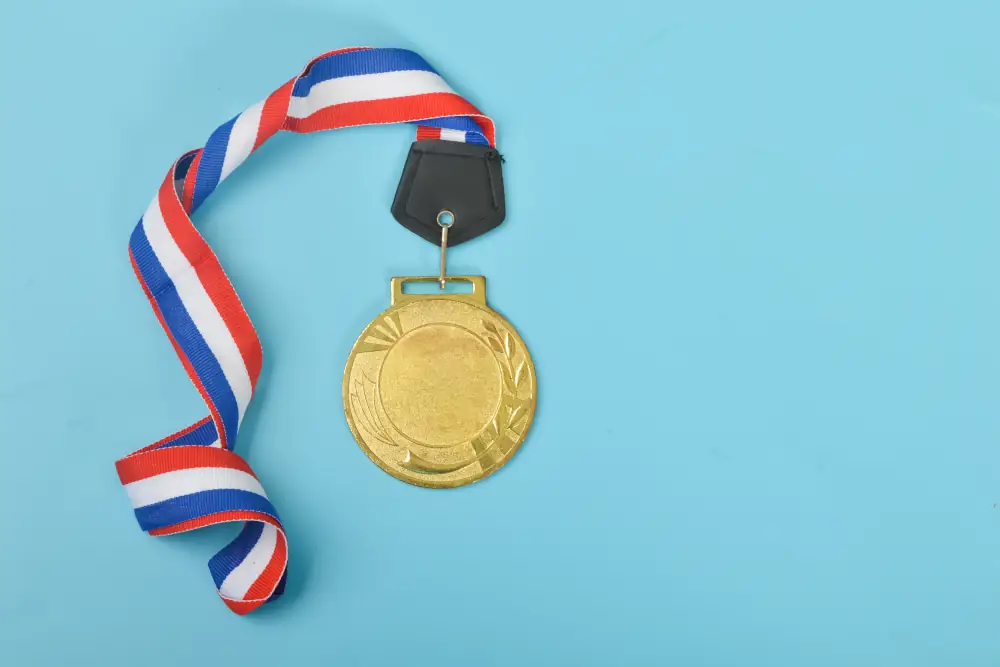 Strickland's Bronze IAQ Options Package - Picture of a bronze coin trophy attached to a red,white and blue ribbon.