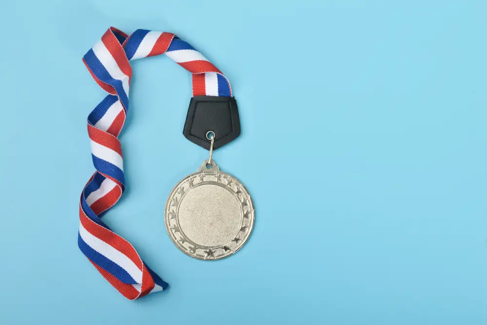 Strickland's Silver IAQ Options Package - Picture of a silver coin trophy attached to a red,white and blue ribbon.