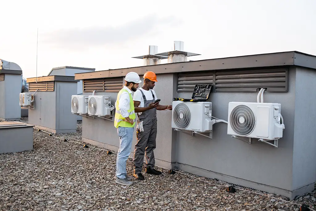 HVAC techinicians checking heat pumps
