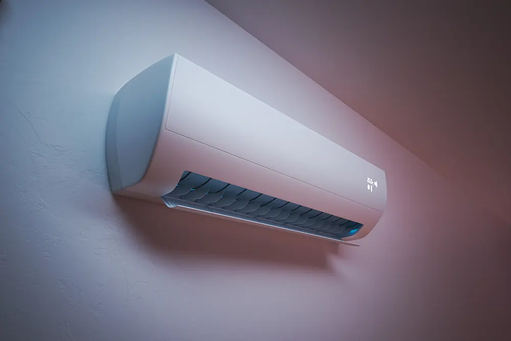 Modern wall-mounted air conditioner unit cooling a room