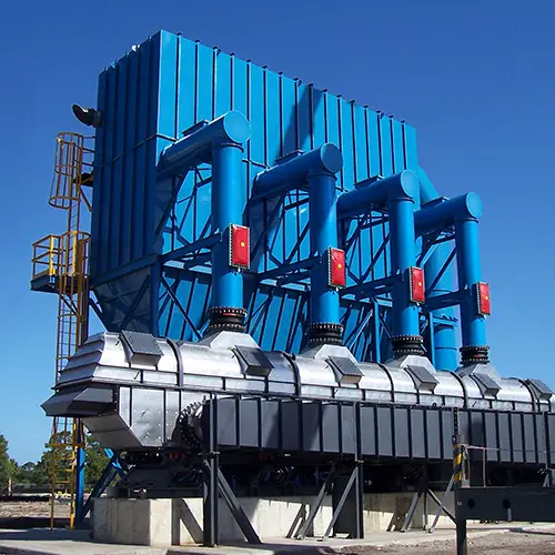 baghouse-fluid-bed-dryer | Sly Air Pollution Control Industrial blue processing equipment with three vertical blue pipes and metal ductwork on a concrete pad under a clear sky