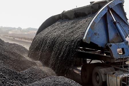 Coal Mining and processing in South Africa | Sly Air Pollution Control Piles of processed coal next to a rail siding waiting to be put on a train for transporting to a coastal port