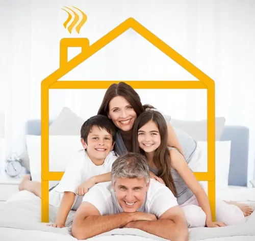 Happy familly looking at the camera on their bed