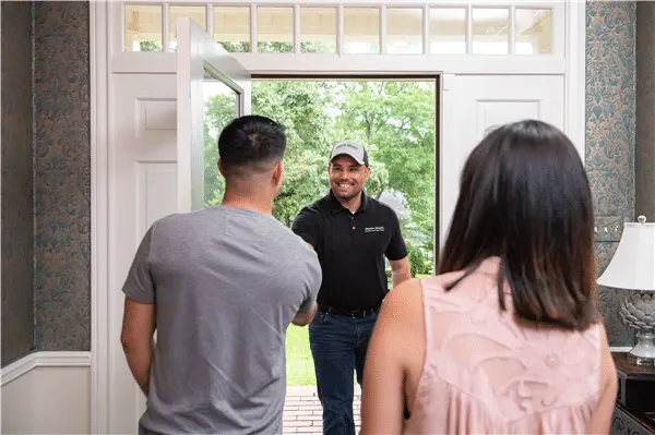 HVAC technician on a residential service call for Berner A/C & Heat