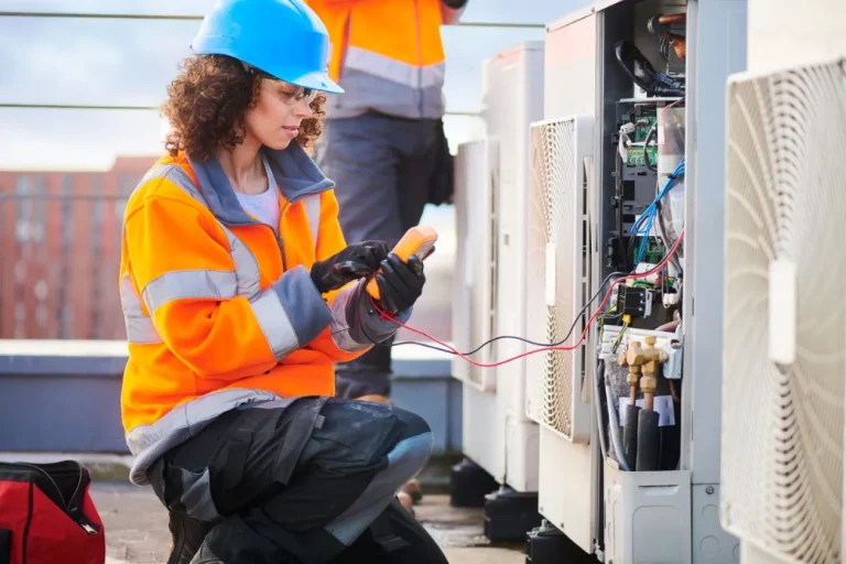 Certified HVAC technician performing residential air conditioning service