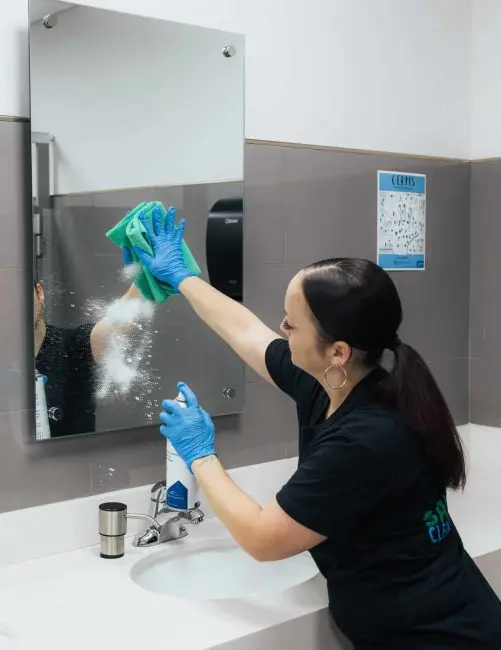 School Janitor cleaning bathroom