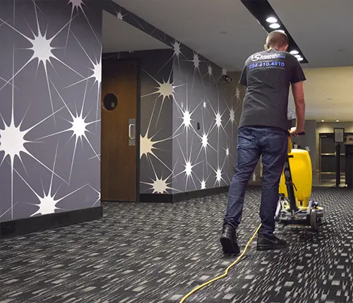 Man providing commercial carpet cleaning for a commercial facility in South Florida