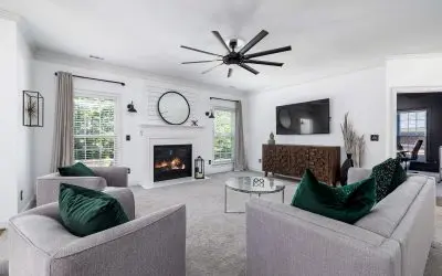 canva-modern-living-room-design-with-fireplace-and-gray-carpet-MAFAkl4aTpE