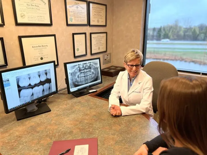 Dr. Renee Kinney patient consultation-Art & Science Family Dentistry Woodbury MN