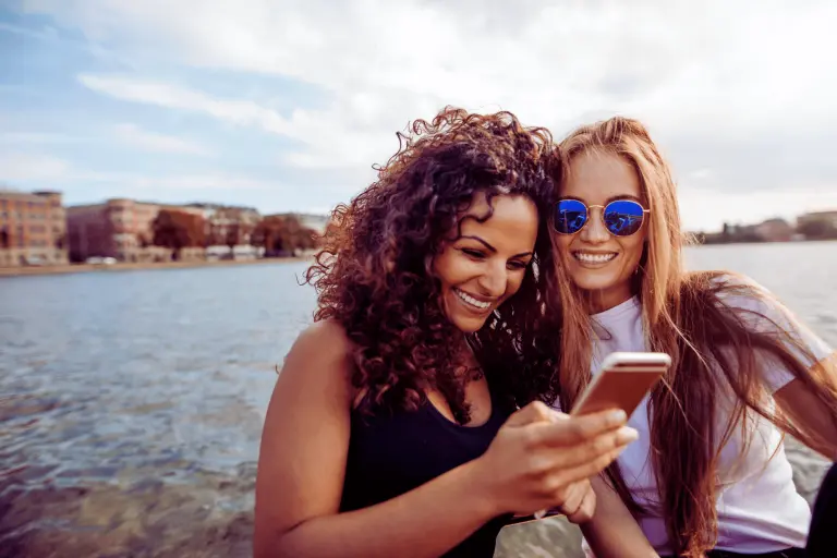 women-searching-on-phone-for-best-dentists-in-Woodbury-MN-Art & Science Family Dentistry