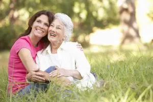 Medicare Insurance senior woman with adult daughter in park