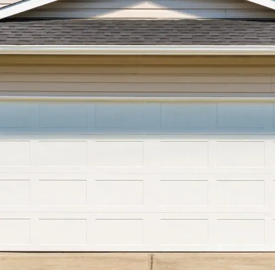 Garage Door Installation brown home with white garage door