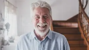 Happy man with full head of hair.